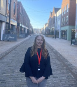 Image of Becky Harding, Account Manager at Summit, stood on Humber Street in Hull. 